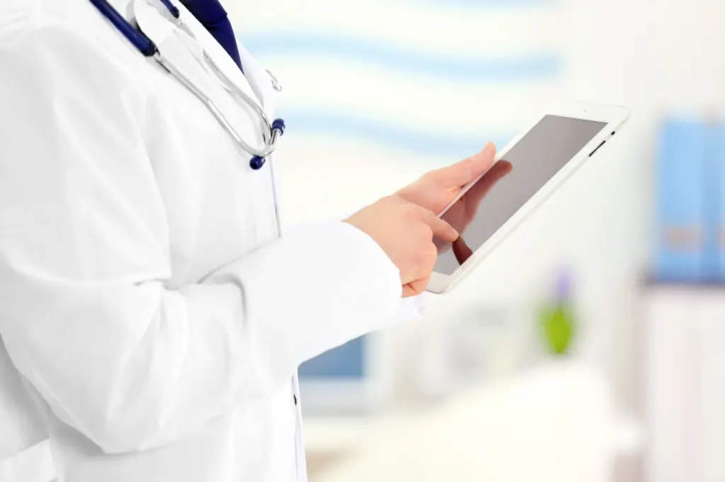 Industrial MD occupational provider reviewing workplace injury guidance